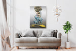 Living room with a gray sofa, decorative pillows, and a wall art piece featuring elephants.
