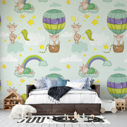 Whimsical Giraffe Hot Air Balloon and Rainbow Clouds Nursery Premium Kids Wallpaper